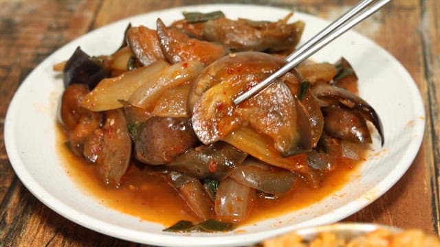 Seasoned eggplant on top of well-mixed rice