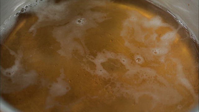 Bonito flakes boiling in a pot