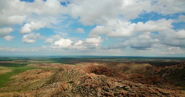 Expansive rocky landscape under a blue sky
