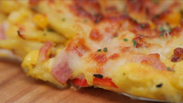 Close-up of a cheesy pizza slice