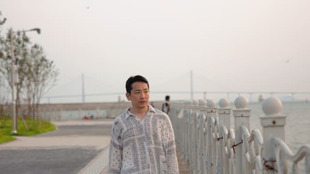 Man walking along a seaside promenade