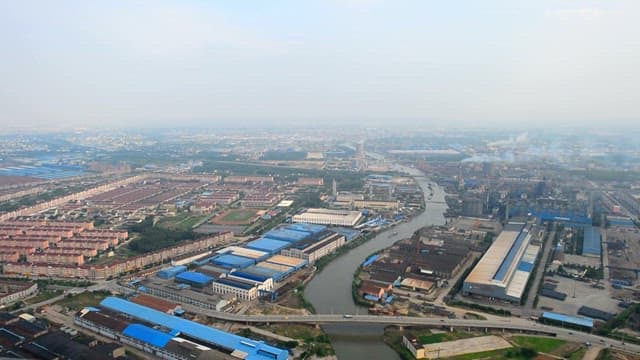 Industrial landscape with factories and smoke