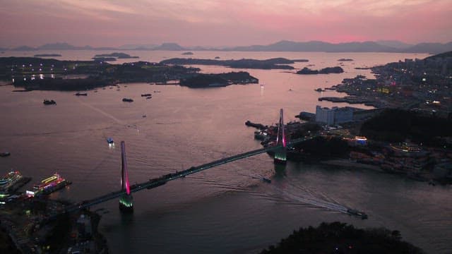 Sunset in Yeosu with a view of Dolsandaegyo Bridge over the sea