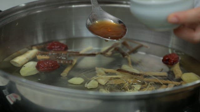 Spices added to a pot of boiling herbal medicine