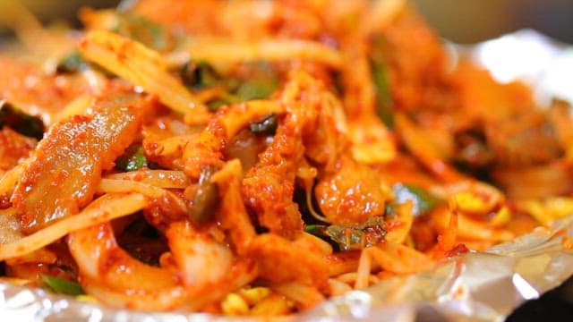 Cow skin salad with wooden chopsticks