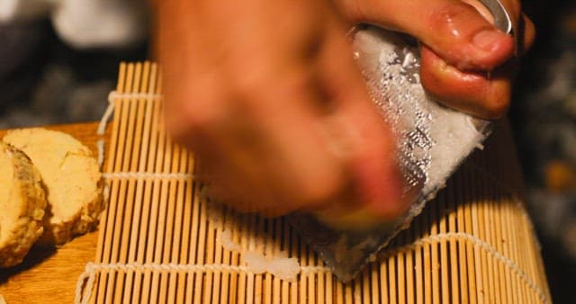 Grinding Radish on a Grater