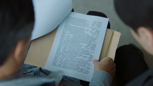 Men Analyzing Data Printed on Paper