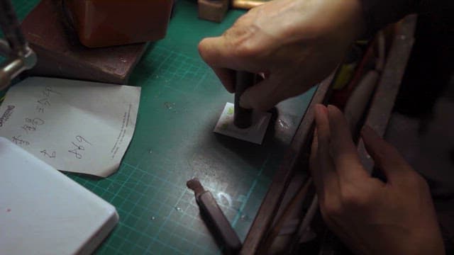 Craftsman Applying Seal on Paper