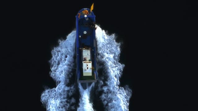 Boat moving swiftly through the sea