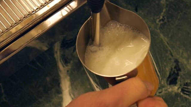 Preparing Frothy Milk Beverage with Steamer