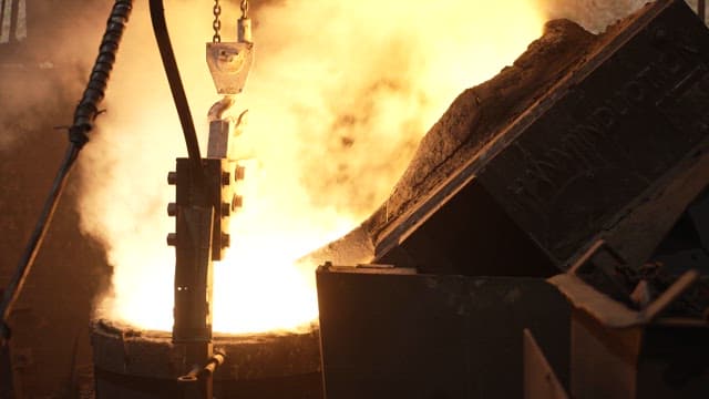 Molten metal being poured in a foundry
