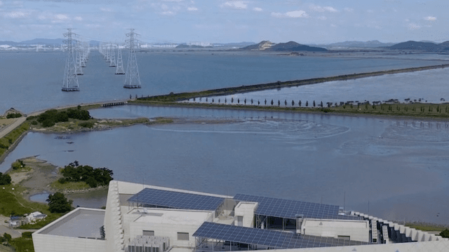 Marine Landscape with Transmission Towers and Buildings