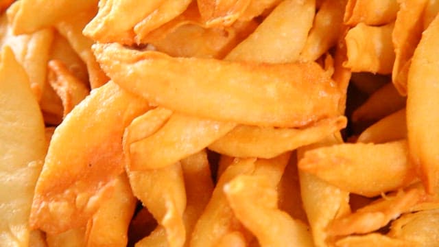 Golden crispy fried dumplings piled up