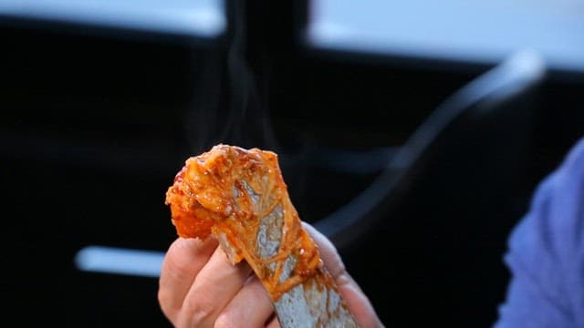 Slice of Chicago pizza with stretchy cheese