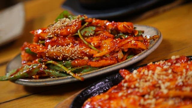 Appetizingly plated deodeok salad and seasoned grilled deodeok