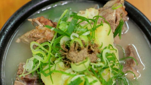 Braised pork backbone with clear soup in an hot pot
