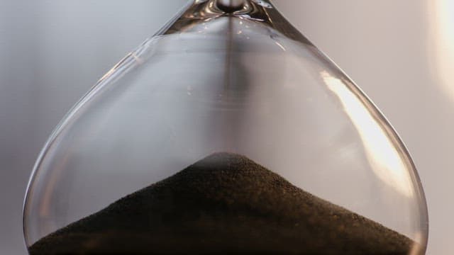Hourglass with Black Sand Flowing