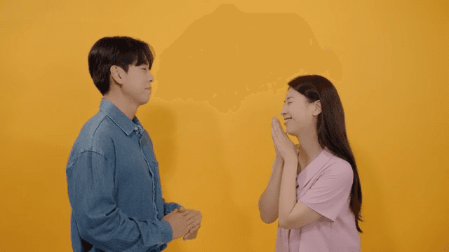 Man and a woman facing each other and talking intimately