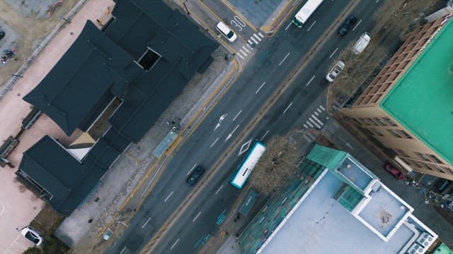 Road with cars passing by next to the Hanok Village