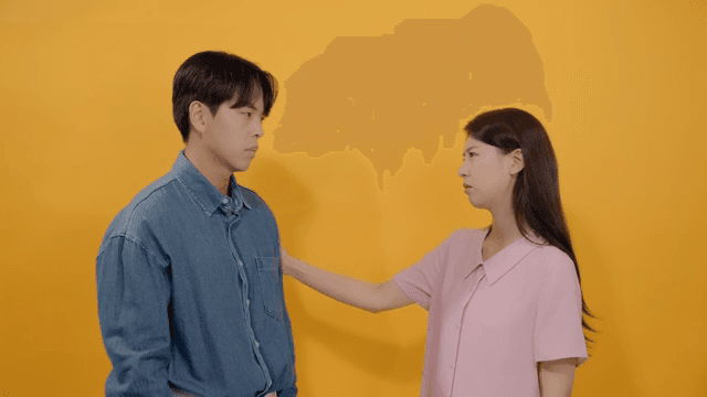 Woman comforting a man with a worried expression