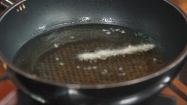 Frying Breadcrumbed Asparagus in Oil