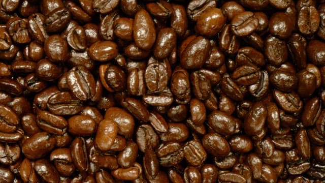Roasted coffee beans falling from above