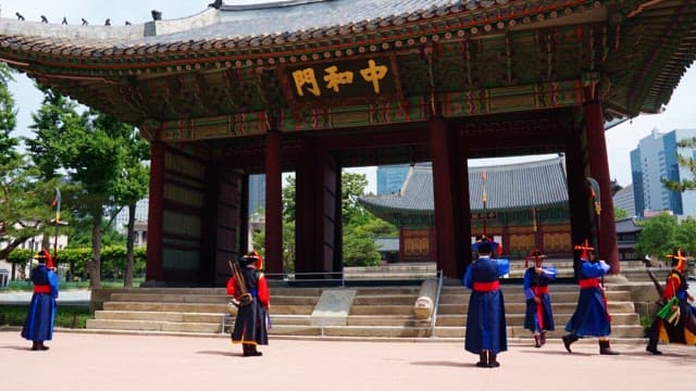 Traditional guards at Deoksugung Palace wearing hanbok in the city center