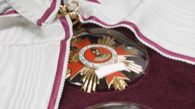 Close-up view of a prestigious Order of Culture with ribbon