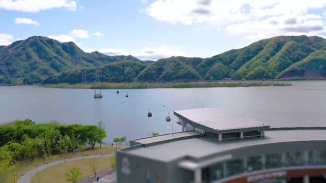 Cable Cars over the Lake Amidst Scenic Mountains