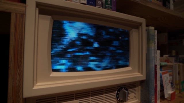 Digital Screen Reflected on a Vintage Television