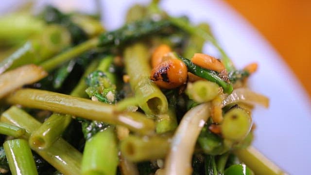 Stir-fried morning glory on a plate