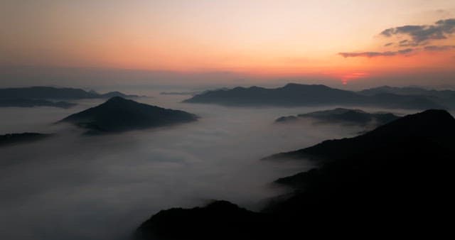 Majestic Sunrise Over Misty Mountains