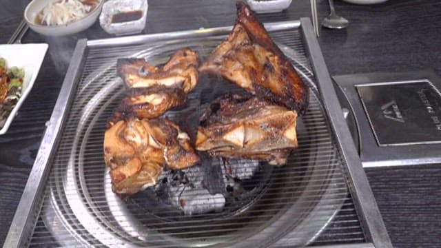 Grilled fish on a mesh grill