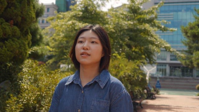 Woman joyfully running in a park