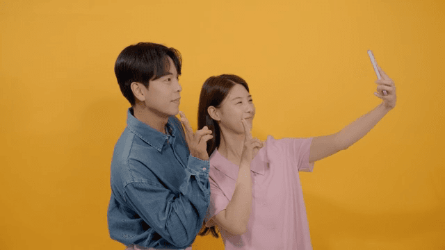 Man and a woman taking intimate selfies in various poses