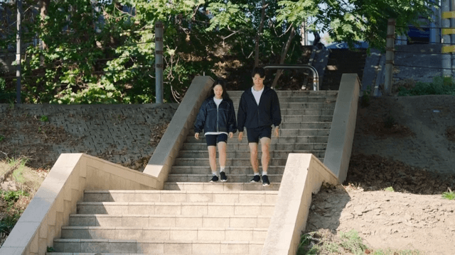 Couple walking down outdoor stairs