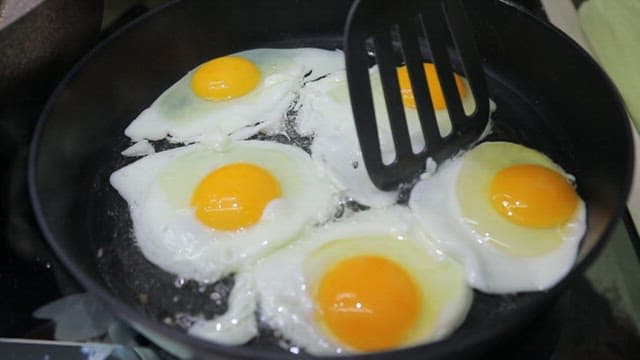 Frying eggs and cooking minced meat