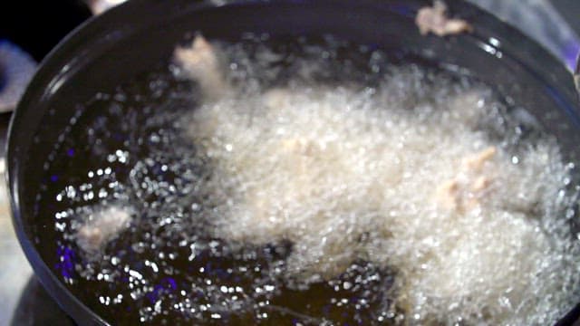 Battered pork in hot oil