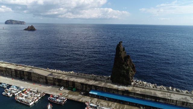 Deep Blue Sea and Dock on a Sunny Day