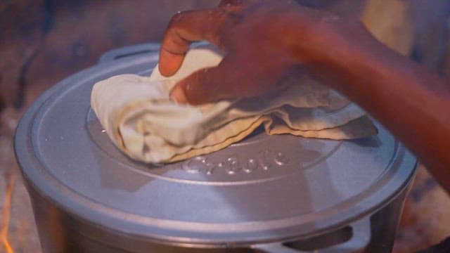Fish curry cooking in a large pot