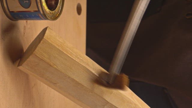 Applying varnish to a wooden surface
