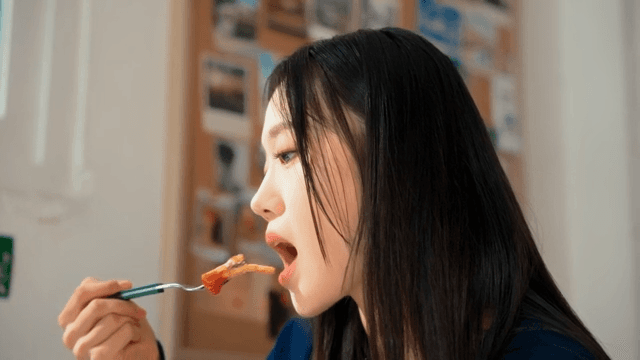Woman enjoying a meal indoors