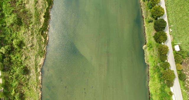 Waves crashing against concrete barriers