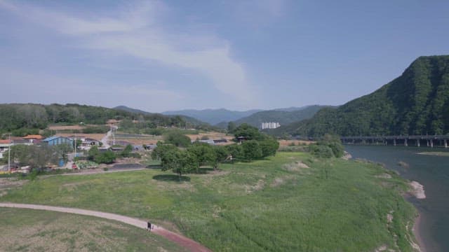 Serene Riverside Village with Bridge