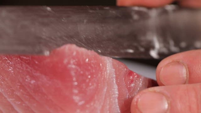 Slicing fresh yellow tail with precision