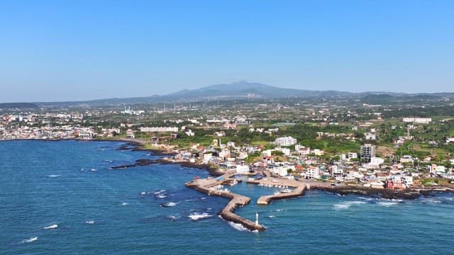 Coastal village with a scenic mountain backdrop