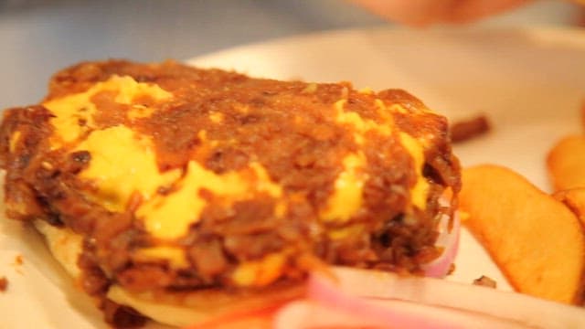 Hamburger made with tomatoes, onions, and patties