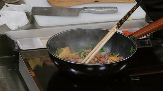 Preparing a hearty vegetable stir-fry in a kitchen