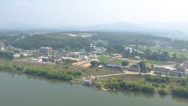 Rural village with fields and river