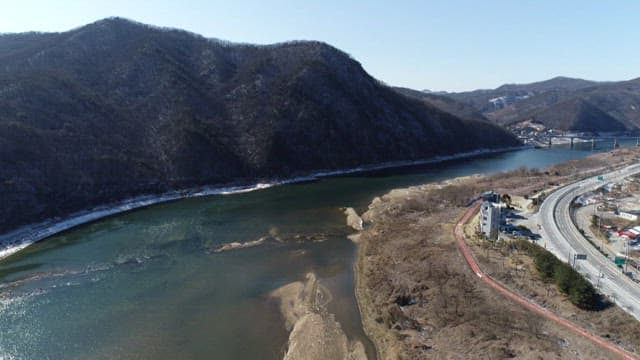 Geumgang River winding through mountains and town